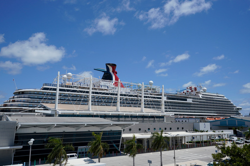 FILE - Carnival Cruise Line's Carnival Horizon cruise ship is shown docked at PortMiami, Friday, April 9, 2021, in Miami. (AP Photo/Wilfredo Lee,File)