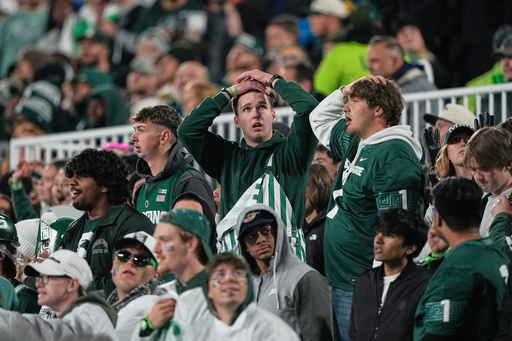 Michigan State fans react during the first half of an NCAA college football game against Michigan Saturday, Oct. 25, 2025, in East Lansing, Mich. (AP Photo/Ryan Sun)