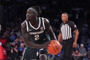 Michigan State's Kur Teng (2) looks to pass during the second half of an NCAA college basketball game against Kentucky Tuesday, Nov. 18, 2025, in New York. (AP Photo/Frank Franklin II)