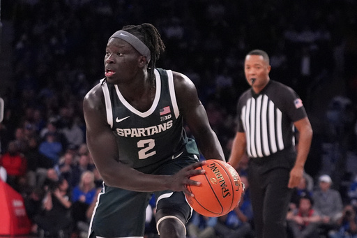 Michigan State's Kur Teng (2) looks to pass during the second half of an NCAA college basketball game against Kentucky Tuesday, Nov. 18, 2025, in New York. (AP Photo/Frank Franklin II)