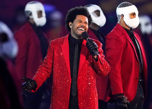 FILE - The Weeknd performs during the halftime show of the NFL Super Bowl 55 football game between the Kansas City Chiefs and Tampa Bay Buccaneers, on Feb. 7, 2021, in Tampa, Fla. (AP Photo/Ashley Landis, File)