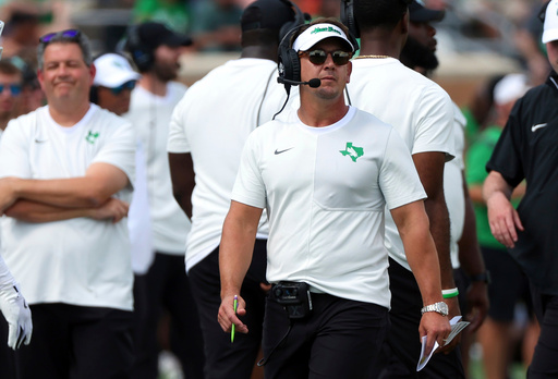 FILE - North Texas head coach Eric Morris walks the sideline during an NCAA college football game against Washington State, Sept. 13, 2025, in Denton, Texas. (AP Photo/Richard W. Rodriguez, file)