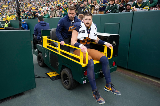 Green Bay Packers tight end Tucker Kraft (85) leaves the field on a cart after an injury during the second half of an NFL football game against the Carolina Panthers, Sunday, Nov. 2, 2025, in Green Bay, Wis. (AP Photo/Morry Gash)