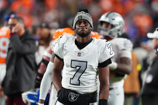 Las Vegas Raiders quarterback Geno Smith heads off the field after an NFL football game against the Denver Broncos, Thursday, Nov. 6, 2025, in Denver. (AP Photo/David Zalubowski)