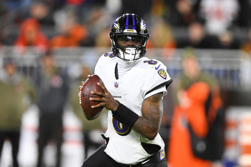 Baltimore Ravens quarterback Lamar Jackson (8) rolls out of the pocket in the second half of an NFL football game against the Cleveland Browns in Cleveland, Sunday, Nov. 16, 2025. (AP Photo/David Richard)