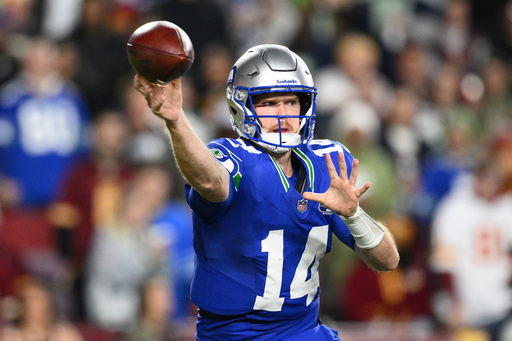 Seattle Seahawks quarterback Sam Darnold (14) passes the ball during the first half of an NFL football game against Washington Commanders, Sunday, Nov. 2, 2025, in Landover, Md. (AP Photo/Nick Wass)