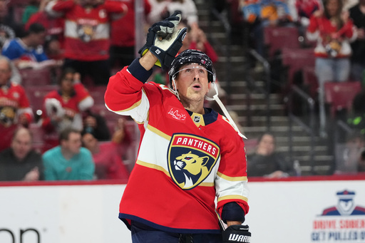 Florida Panthers left wing Brad Marchand celebrates after scoring a goal during the second period of an NHL hockey game against the Dallas Stars, Saturday, Nov. 1, 2025, in Sunrise, Fla. (AP Photo/Lynne Sladky)