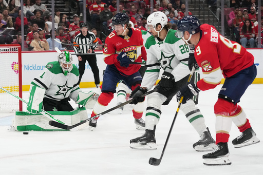 Dallas Stars goaltender Casey DeSmith (1) defends the goal during the second period of an NHL hockey game against the Florida Panthers, Saturday, Nov. 1, 2025, in Sunrise, Fla. (AP Photo/Lynne Sladky)