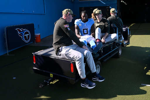 Tennessee Titans wide receiver Calvin Ridley is taken off the field after being injured during the first half of an NFL football game against the Houston Texans on Sunday, Nov. 16, 2025, in Nashville, Tenn. (AP Photo/John Amis)