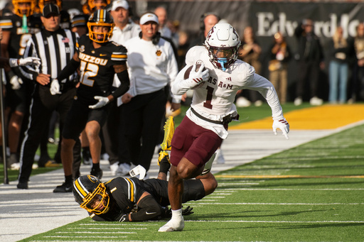 Texas A&M wide receiver Mario Craver, right, runs past Missouri safety Marvin Burks, left, during the first half an NCAA college football game Saturday, Nov. 8, 2025, in Columbia, Mo. (AP Photo/L.G. Patterson)