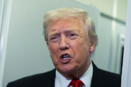 President Donald Trump speaks to reporters on board Air Force One on his way back to the White House from a weekend trip at his Mar-a-Lago estate in Palm Beach, Fla., Sunday, Nov. 2, 2025. (AP Photo/Manuel Balce Ceneta)