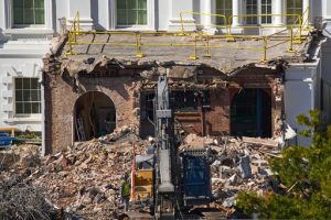 FILE - A worker walks among debris from a largely demolished part of the East Wing of the White House, Oct. 23, 2025, in Washington, before construction of a new ballroom. (AP Photo/Jacquelyn Martin)