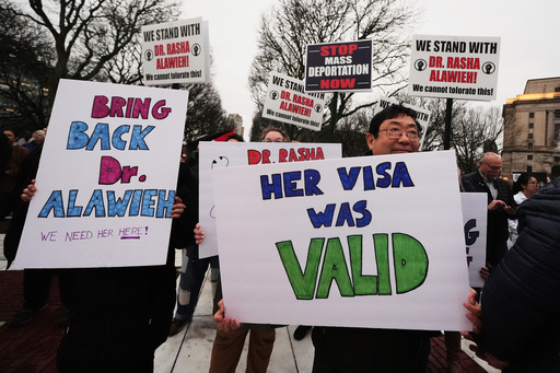 FILE - Protesters rally outside the Rhode Island State House in support of deported Brown University Dr. Rasha Alawieh, March 17, 2025, in Providence, R.I. (AP Photo/Charles Krupa, File)