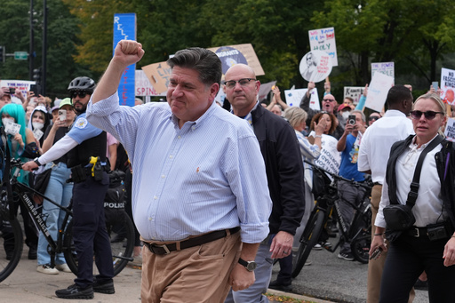 Illinois Gov. JB Pritzker, arrives during a "No Kings" protest Saturday, Oct. 18, 2025, in Chicago. (AP Photo/Nam Y. Huh)