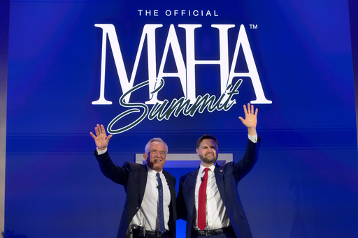 Vice President JD Vance, right, and Health and Human Services Secretary Robert F. Kennedy, Jr., wave as they depart the inaugural Make America Healthy Again summit at the Waldorf Astoria, Wednesday, Nov. 12, 2025, in Washington. (AP Photo/Rod Lamkey, Jr.)