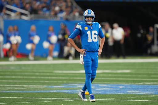 Detroit Lions quarterback Jared Goff (16) reacts after a penalty called on the Lions during the second half of an NFL football game against the Minnesota Vikings Sunday, Nov. 2, 2025, in Detroit. (AP Photo/Paul Sancya)