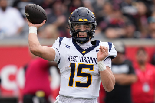 West Virginia quarterback Scotty Fox Jr. throws a pass against Houston during the second half of an NCAA college football game Saturday, Nov. 1, 2025, in Houston. (AP Photo/Eric Christian Smith)