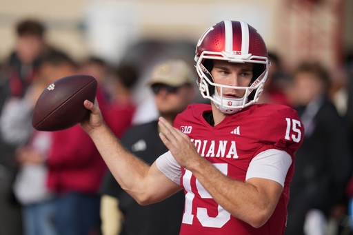 Indiana quarterback Fernando Mendoza throws before an NCAA college football game against Wisconsin, Saturday, Nov. 15, 2025, in Bloomington, Ind. (AP Photo/Darron Cummings)